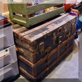 F93. Antique steamer trunk.